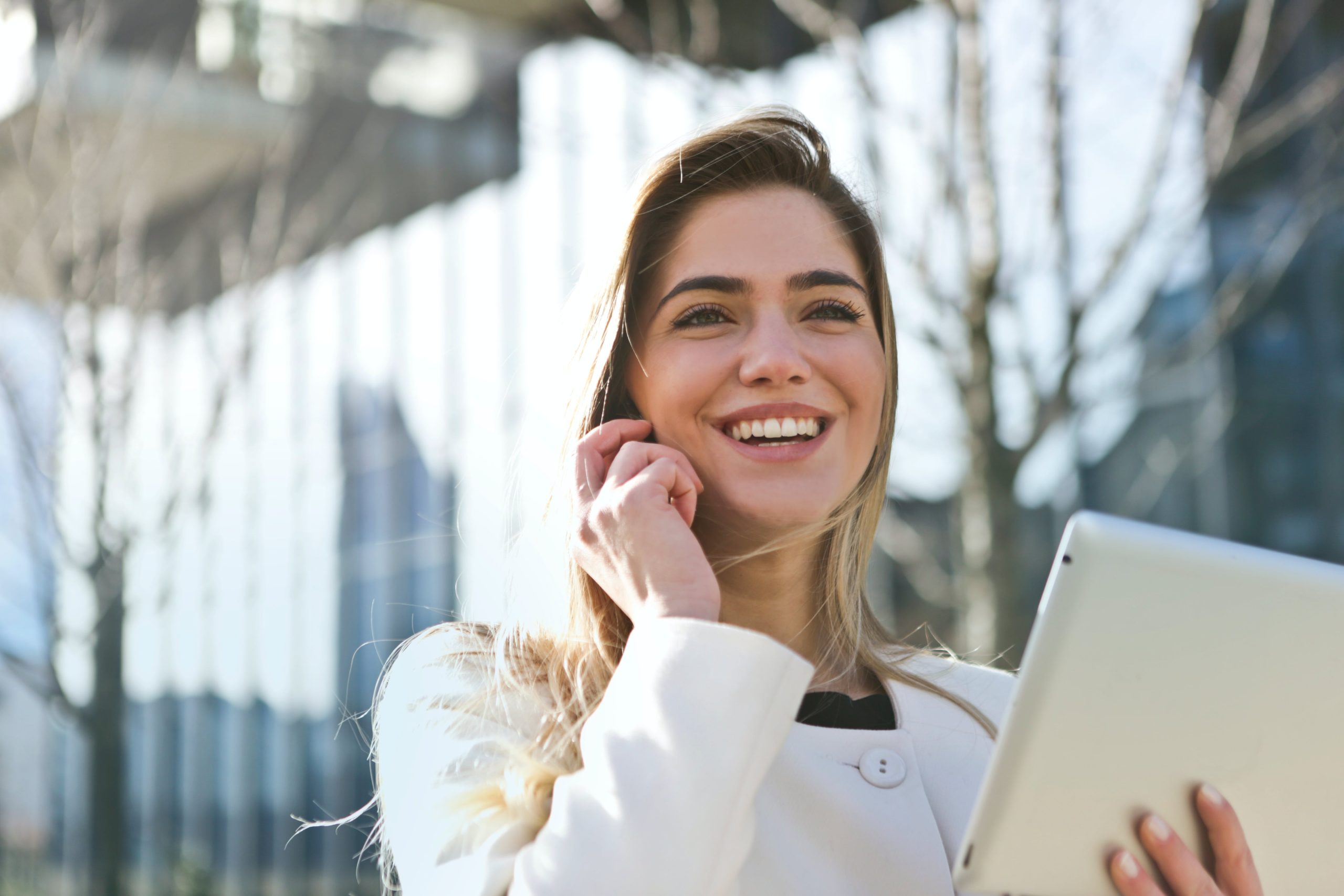 Woman call to action holding tablet computer